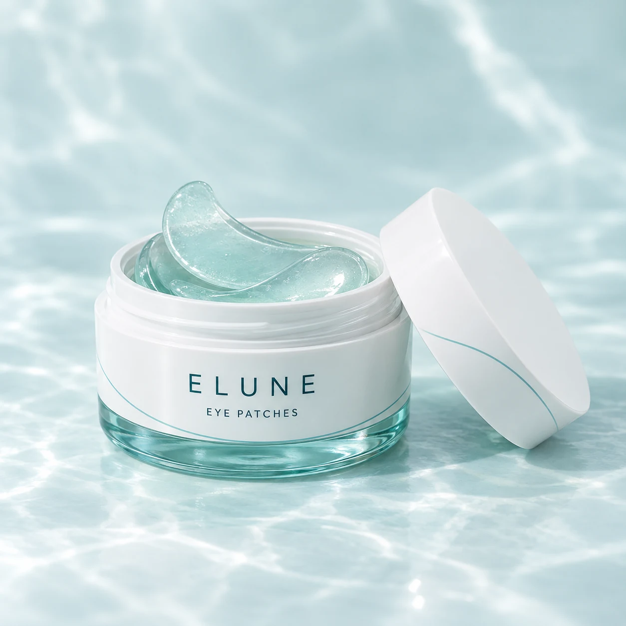 ELUNE eye patch jar with translucent aqua crescent patches